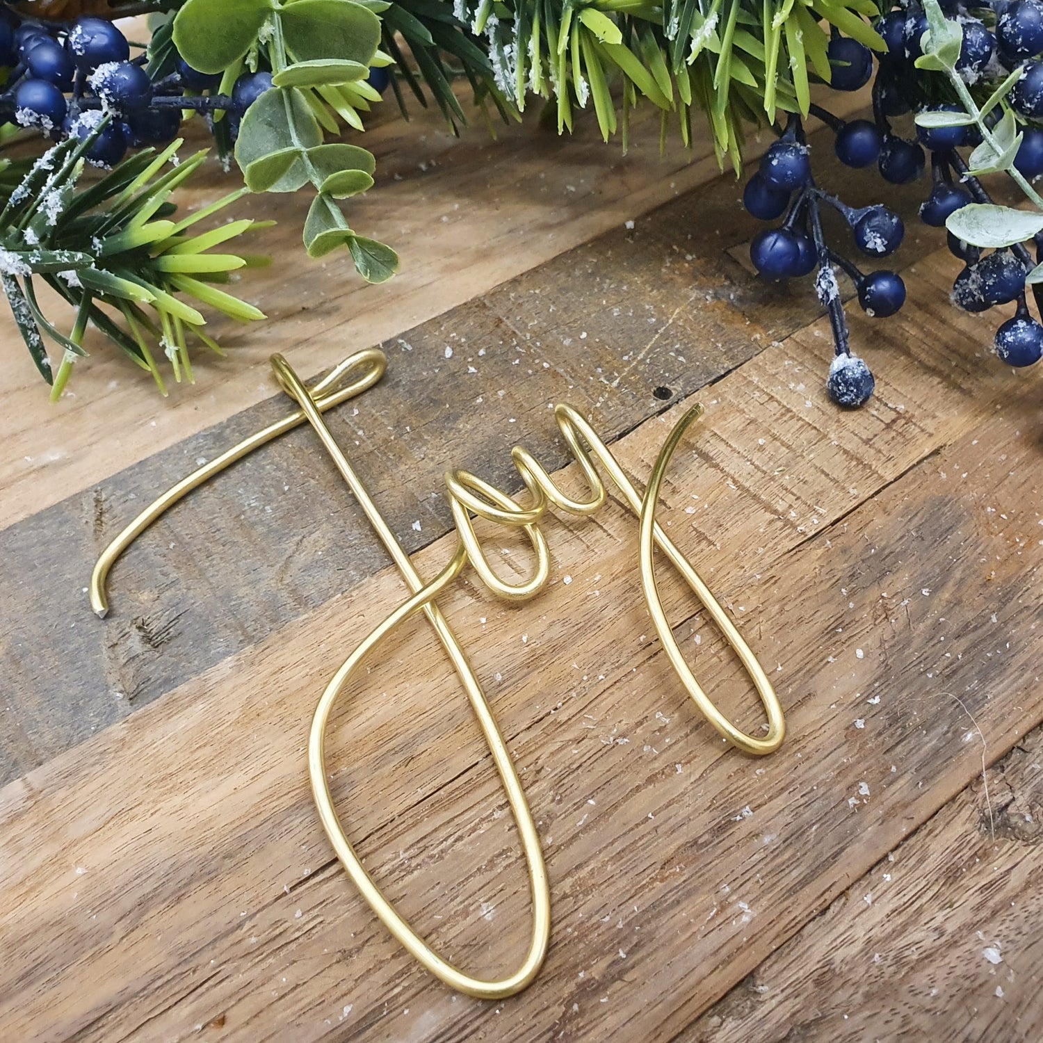 Gold Joy Wire Word Mantle or Table Decoration Framed with a Festive Berry Garland