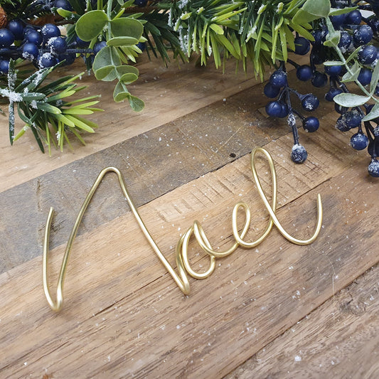 Gold Noel Wire Word Mantle or Table Decoration Framed with a Festive Berry Garland