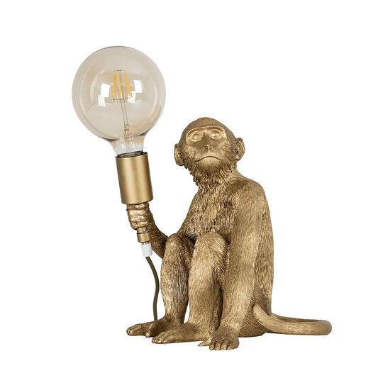 Martha the Monkey Table Lamp in Metallic Gold Holding A Light Bulb          