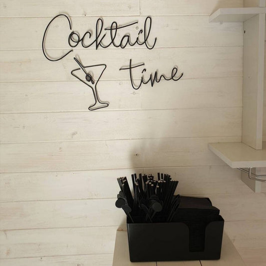 Black Cocktail Time wire word wall art with a Martini Glass hung on the wall above a bar
